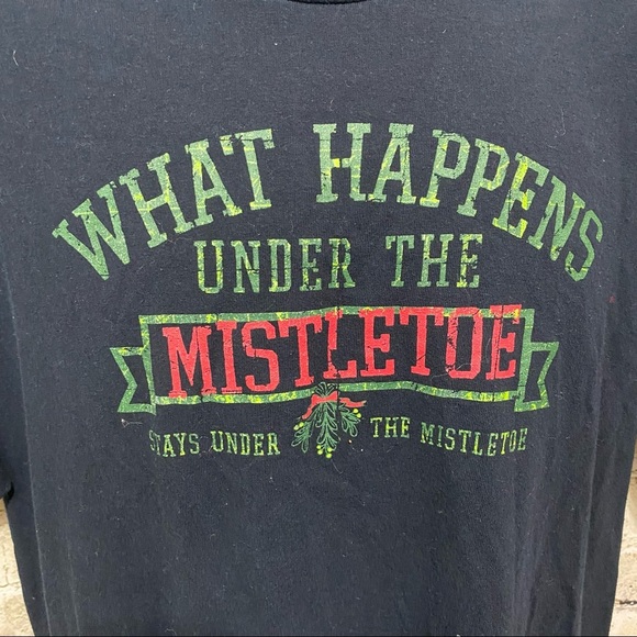 WHAT HAPPENS UNDER THE MISTLETOE Christmas T Shirt - Picture 2 of 4